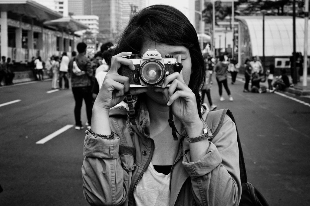 a person holding a camera
